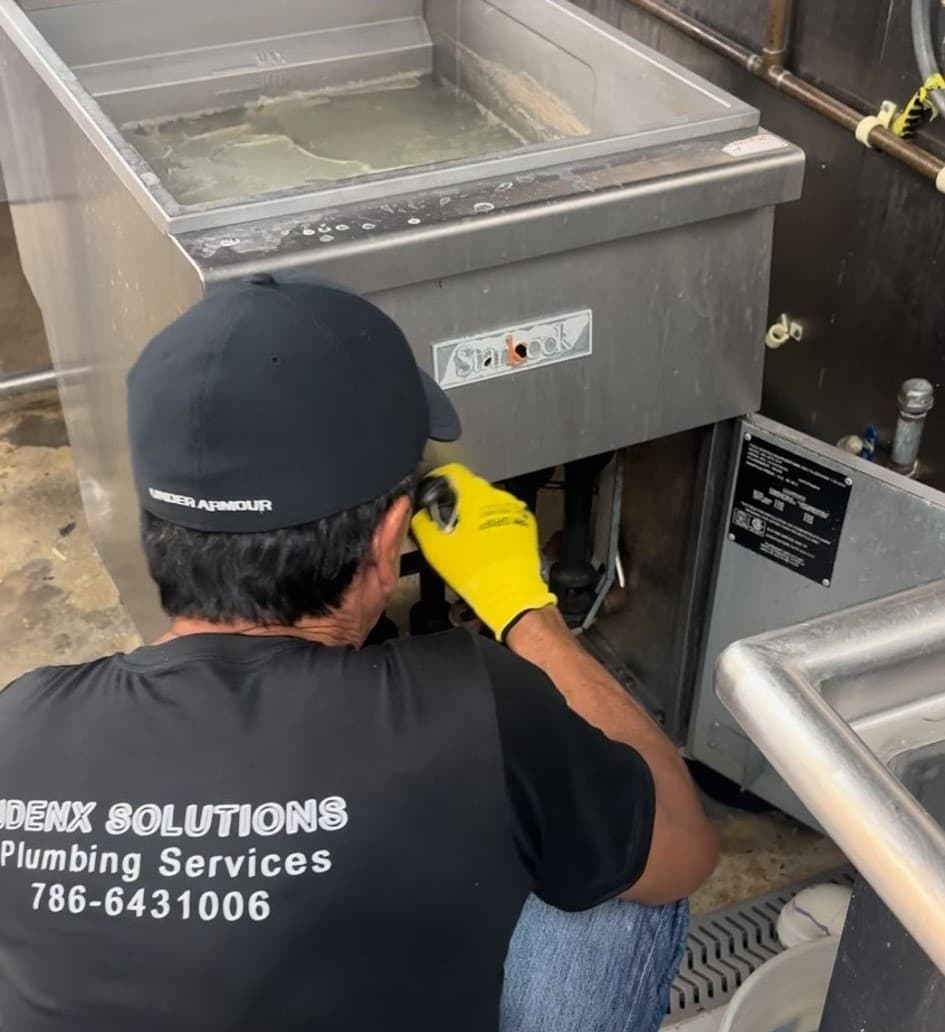 Plumber in Doral working on a project